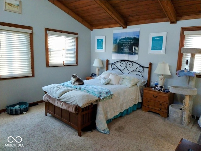 carpeted bedroom with lofted ceiling with beams and wooden ceiling