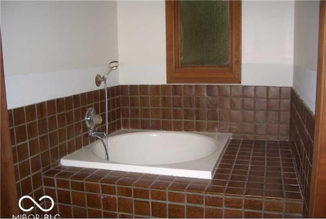 bathroom featuring a relaxing tiled tub