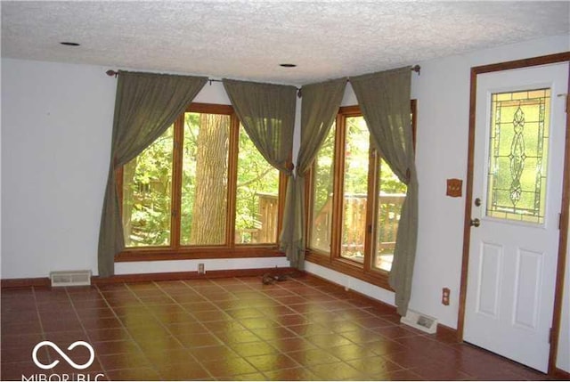 interior space with a textured ceiling