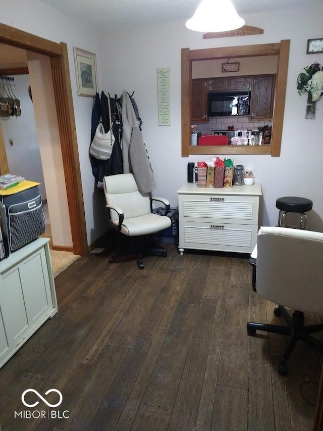 home office with dark wood-type flooring