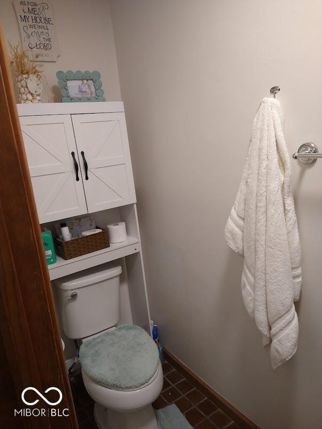 bathroom featuring tile patterned floors and toilet