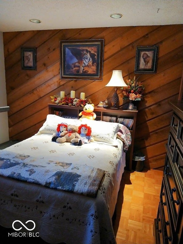 bedroom featuring light parquet flooring