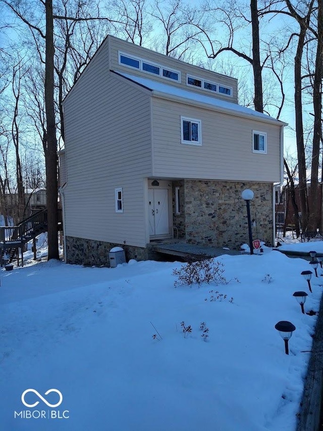 view of snow covered house