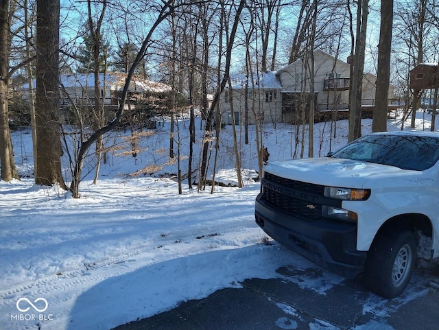 view of yard layered in snow