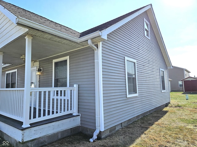 view of side of home with a porch