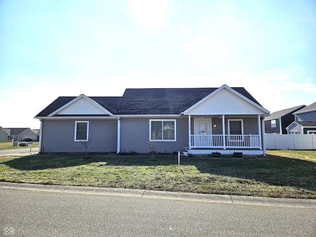 single story home with a porch and a front lawn