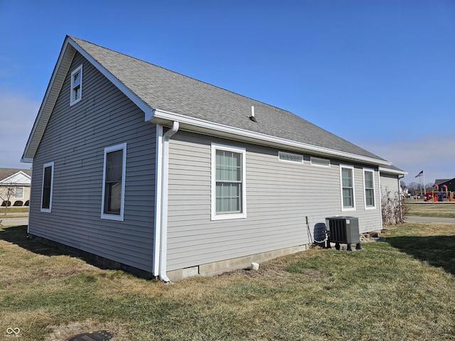 view of home's exterior featuring a lawn and central air condition unit