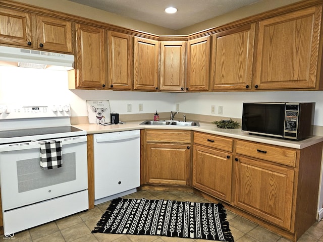 kitchen with sink and white appliances