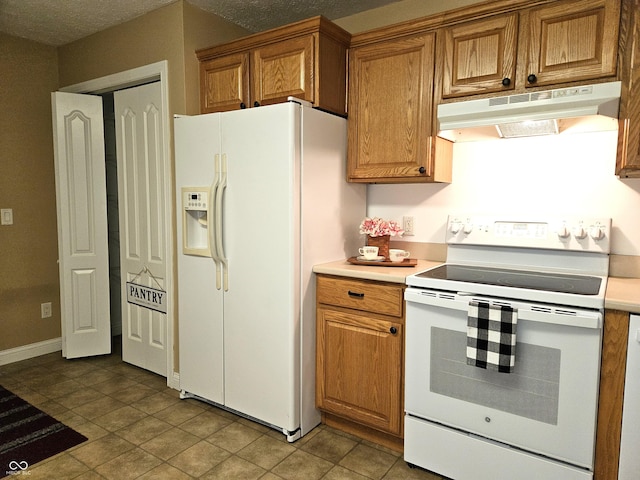 kitchen featuring white appliances