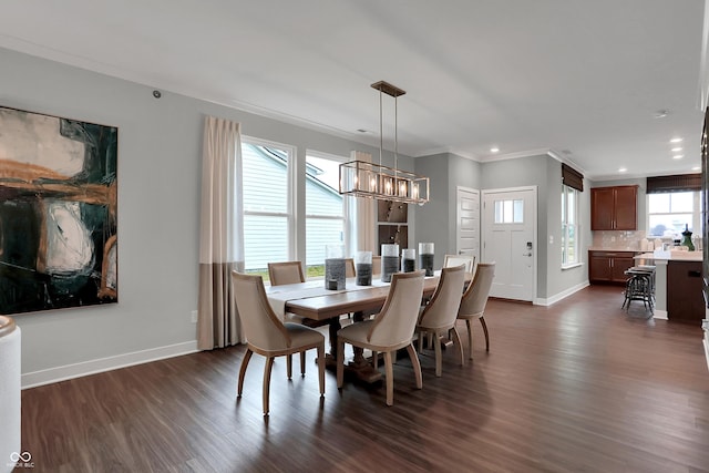 dining space featuring dark wood-style floors, recessed lighting, baseboards, and crown molding