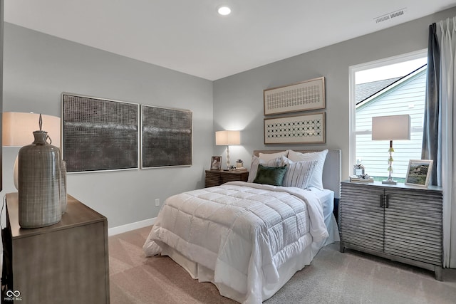 bedroom featuring light carpet, recessed lighting, visible vents, and baseboards