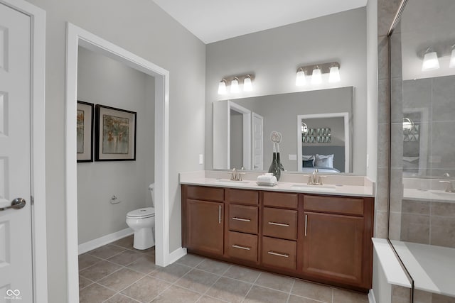 full bath featuring tile patterned flooring, a sink, a tile shower, and double vanity