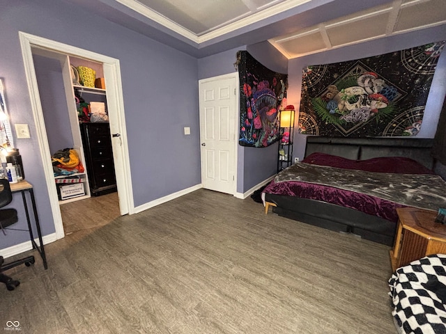 bedroom featuring crown molding and wood-type flooring