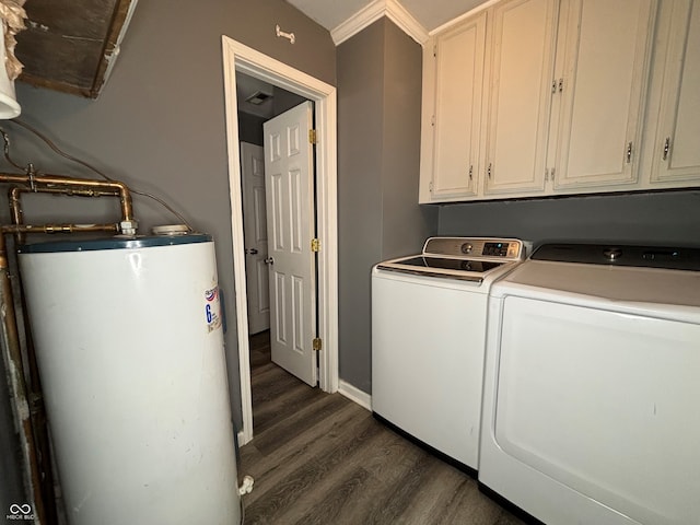 clothes washing area with gas water heater, dark hardwood / wood-style flooring, separate washer and dryer, and cabinets