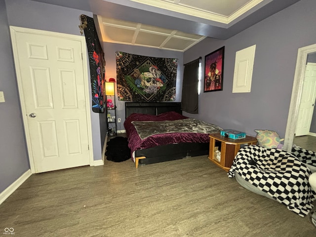 bedroom with crown molding and hardwood / wood-style floors