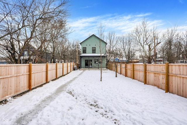 view of yard layered in snow