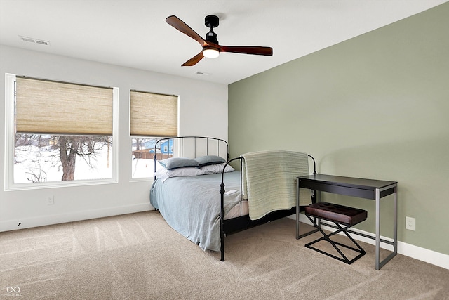 bedroom featuring ceiling fan and light colored carpet