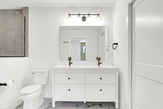 bathroom featuring toilet and vanity