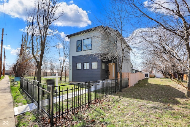 1656 Roosevelt Ave, Indianapolis, IN 46218 - view of home's exterior featuring a lawn and fence