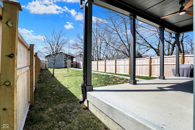 1656 Roosevelt Ave, Indianapolis, IN 46218 - exterior space featuring a patio, a fenced backyard, an outbuilding, and ceiling fan