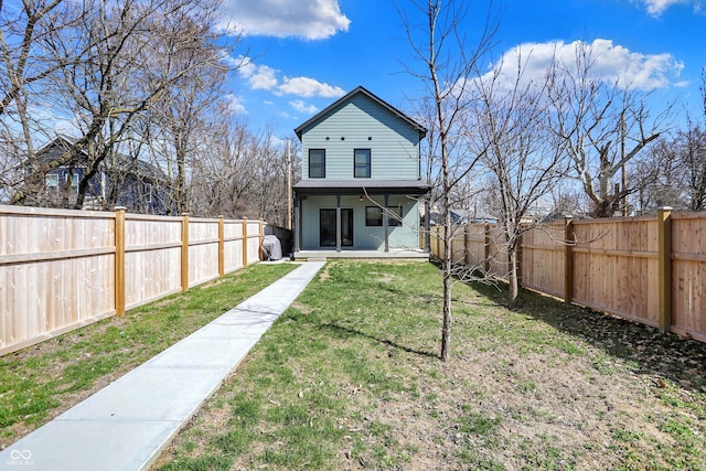 1656 Roosevelt Ave, Indianapolis, IN 46218 - rear view of property with a patio area, a lawn, and a fenced backyard