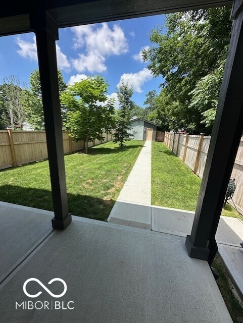 1656 Roosevelt Ave, Indianapolis, IN 46218 - fenced backyard featuring a patio area