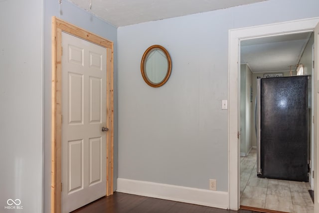 corridor featuring hardwood / wood-style floors