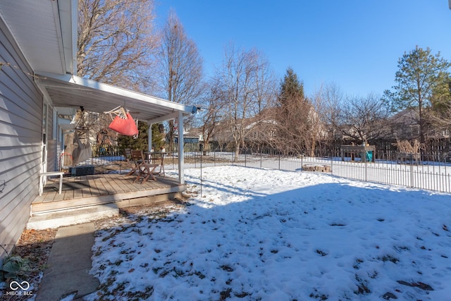 view of yard layered in snow