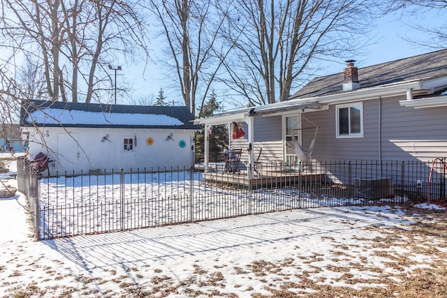 view of snow covered house