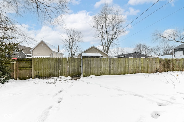 view of yard layered in snow