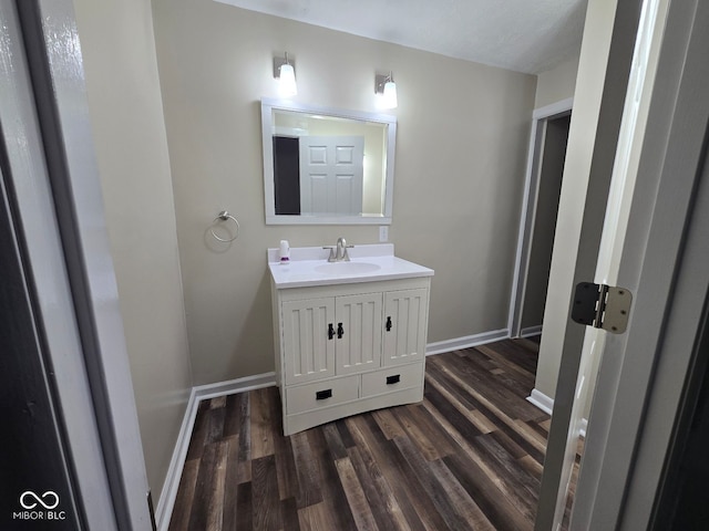 bathroom featuring vanity and hardwood / wood-style flooring