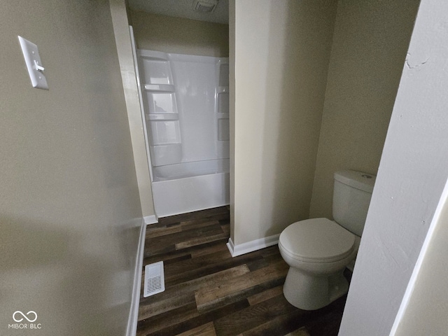 bathroom featuring toilet and wood-type flooring