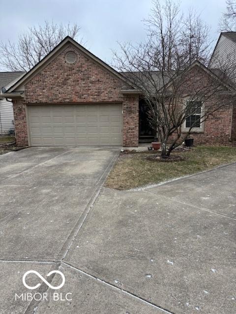 single story home with a garage