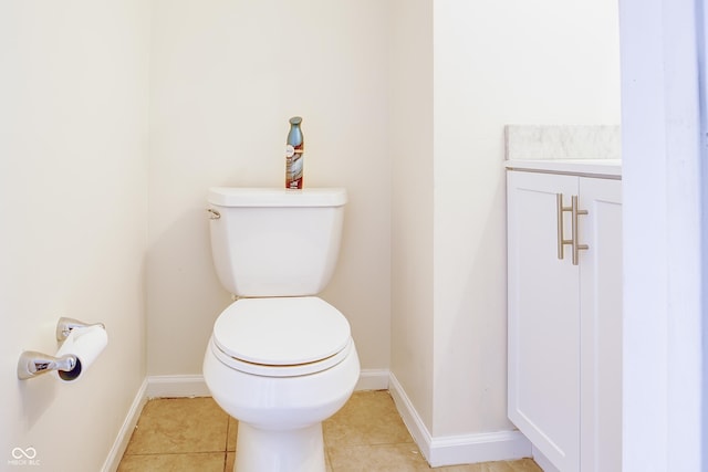 bathroom featuring toilet, tile patterned floors, and vanity