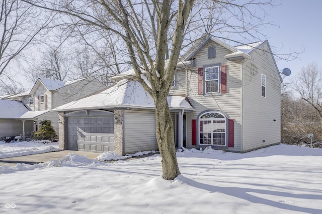 front of property with a garage