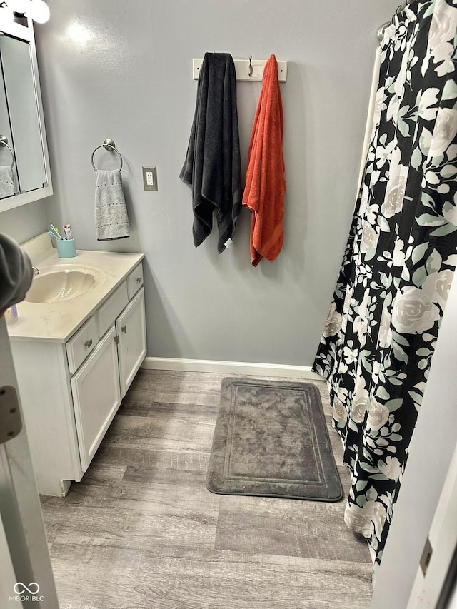 bathroom featuring wood-type flooring and vanity