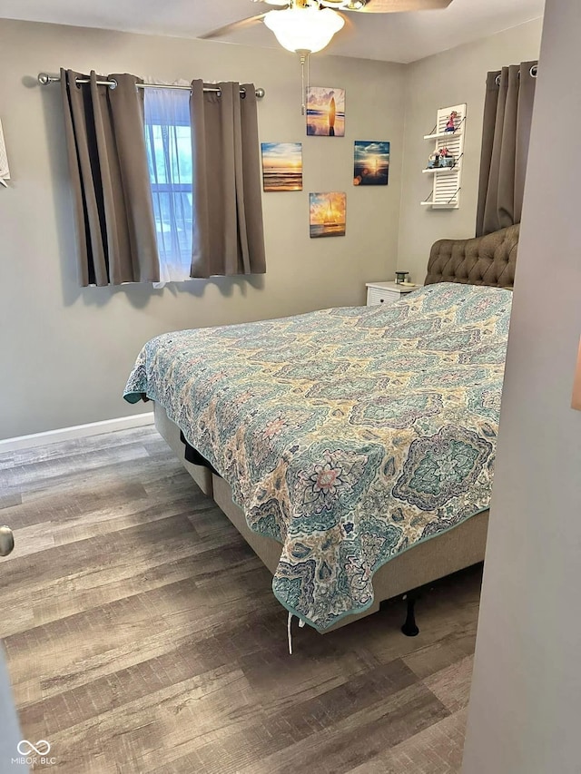 bedroom with ceiling fan and hardwood / wood-style floors