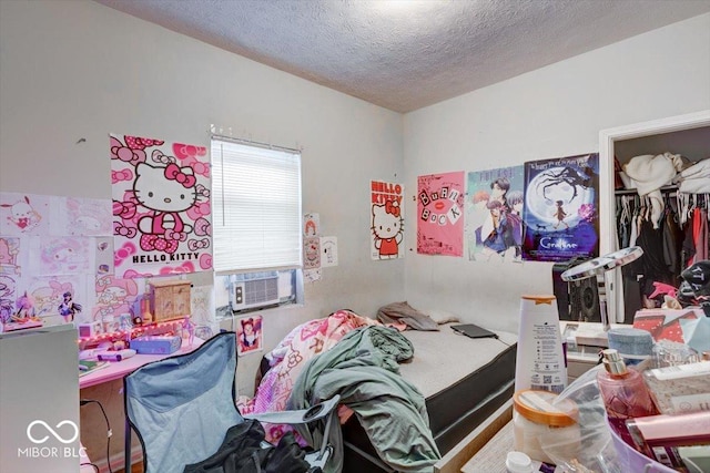 bedroom featuring a closet and a textured ceiling