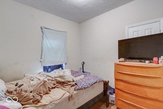 bedroom featuring a textured ceiling