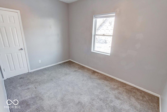 empty room featuring light carpet