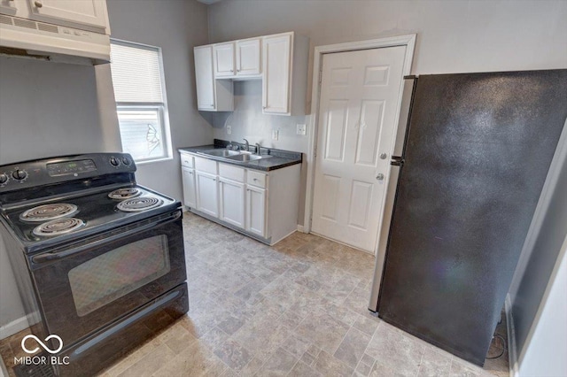 kitchen featuring white cabinetry, black electric range, sink, and stainless steel fridge