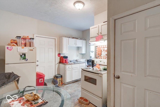 kitchen featuring white cabinetry, white appliances, sink, and a textured ceiling