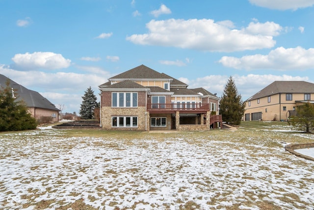 snow covered property featuring a deck