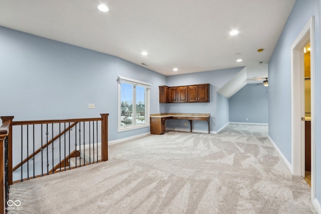 interior space with light carpet and ceiling fan