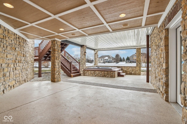 view of patio / terrace featuring an outdoor hot tub