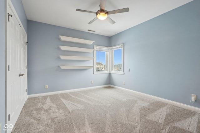 unfurnished bedroom with light carpet and ceiling fan