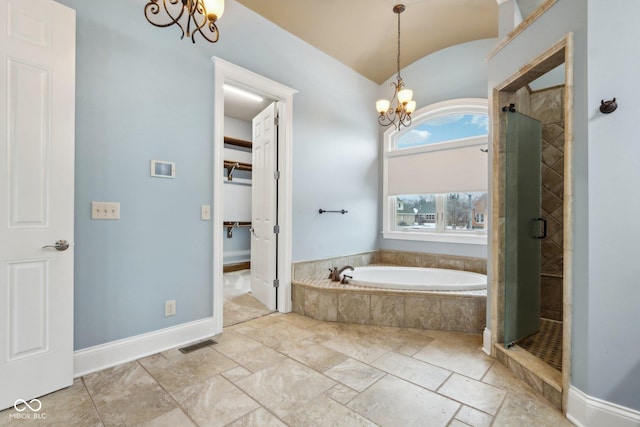 bathroom with plus walk in shower, lofted ceiling, and a notable chandelier