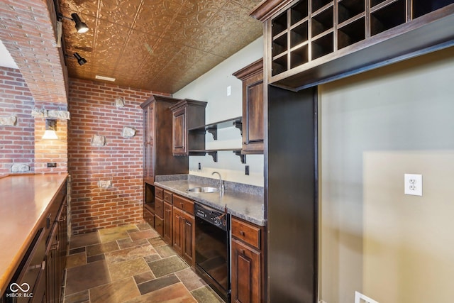 kitchen featuring sink, dark brown cabinets, black dishwasher, brick wall, and stainless steel dishwasher