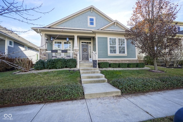 view of front of house with a front lawn and a porch