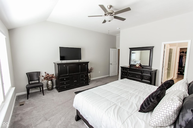 bedroom with lofted ceiling, light colored carpet, and ceiling fan